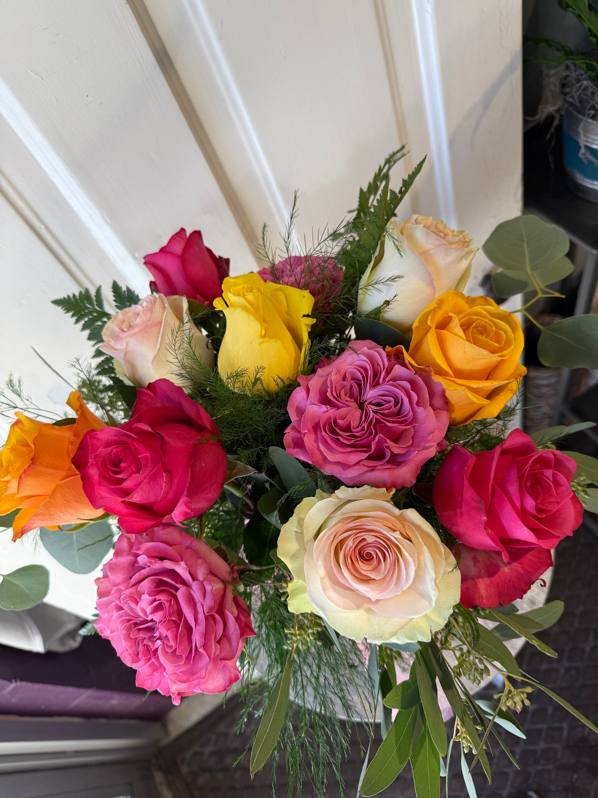 low and lush candy colored dozen roses